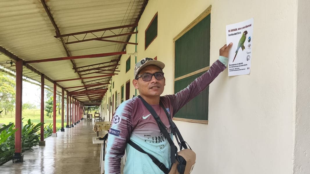 Luis Carlos Martinez with one of the team's posters (photo by Eduar Paez)